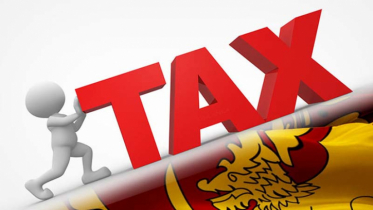 Sri Lanka implements tax hike ahead of foreign debt deal